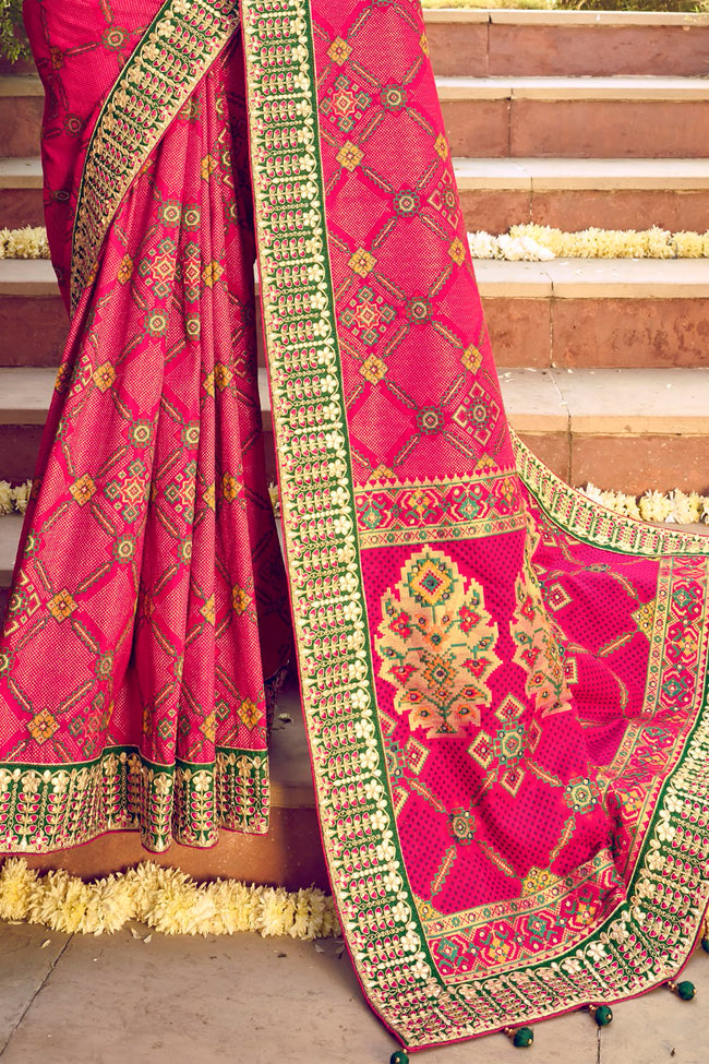 Raspberry Red Bandhej Patola Pure Silk Saree With Embroidered Border Latkan Pallu And Green Embroidered Blouse Piece