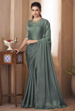 Teal Glass Silk Saree With Embroidery Work Border And Net Blouse Piece