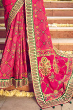 Raspberry Red Bandhej Patola Pure Silk Saree With Embroidered Border Latkan Pallu And Green Embroidered Blouse Piece