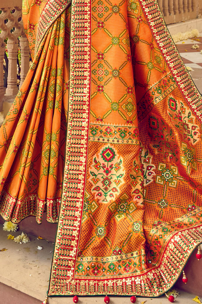 Mustard Bandhej Patola Pure Silk Bandhani Saree With Embroidered Border Latkan Pallu And Red Embroidered Blouse Piece