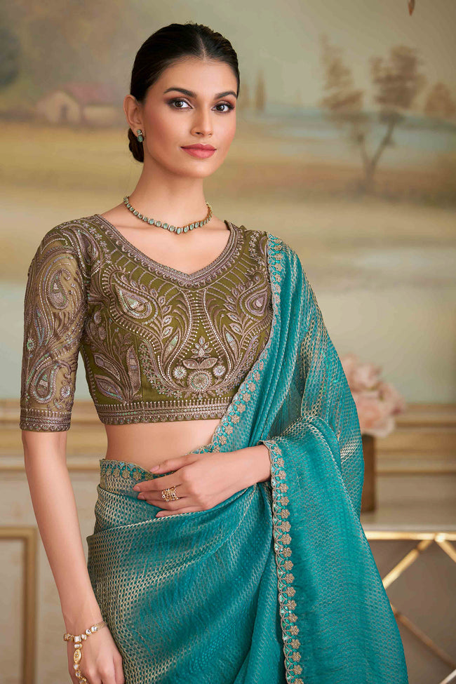Golden Blue Georgette Embroidered Saree With Blouse Piece