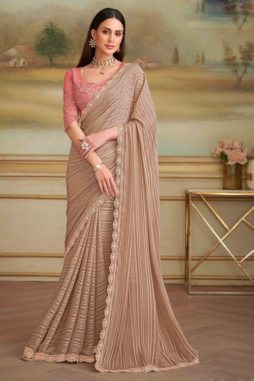 Beige Satin Patteren Embroidered Georgette saree.