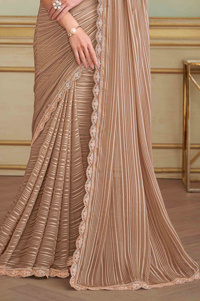 Beige Satin Patteren Embroidered Georgette saree.