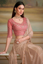 Beige Satin Patteren Embroidered Georgette saree.