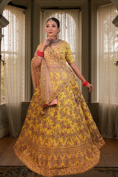Amber Yellow Embroidered Bridal Lehenga In Raw Silk With Floral Hand Embroidery