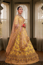 Amber Yellow Embroidered Bridal Lehenga In Raw Silk With Floral Hand Embroidery