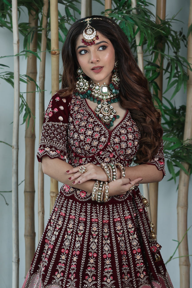 Dark Maroon Lehenga Choli In Velvet With Multi Colored Hand Embroidered Mughal Kalis Bridal Lehenga