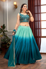 Teal crop top in contrast with Embroidery Lehenga