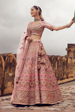 Peach Pink Embroidered Bridal Lehenga With Raw Silk