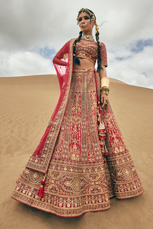 Tomato Red Heavy Embroidered Bridal Lehenga In Raw Silk