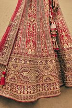 Tomato Red Heavy Embroidered Bridal Lehenga In Raw Silk