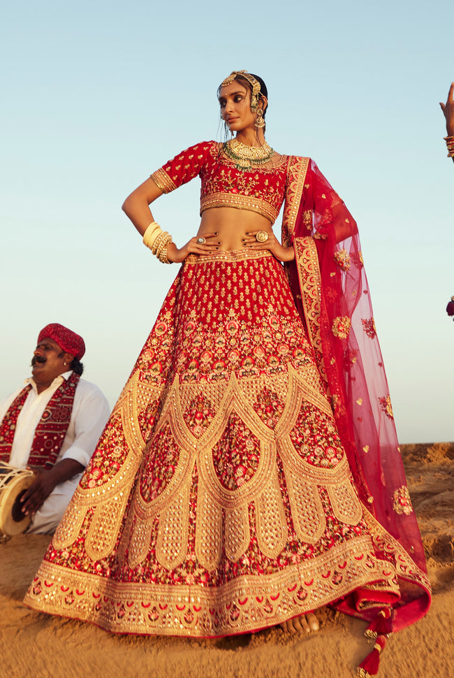 Fiery Red With Golden Bridal Lehenga In Raw Silk With Hand Embroidery